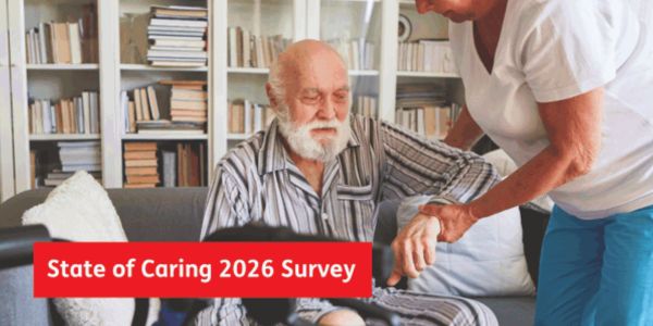 Carers UK State of Caring An image of a family carer helping their cared for stand up in with text overlay reading: Carers UK State of Caring Survey